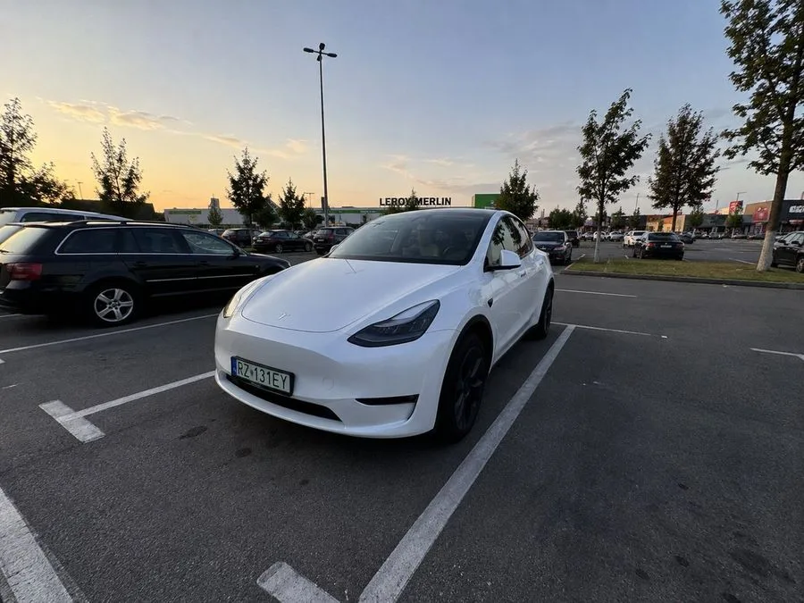 Iphone Photo Tesla Parking Lot, AI generated image